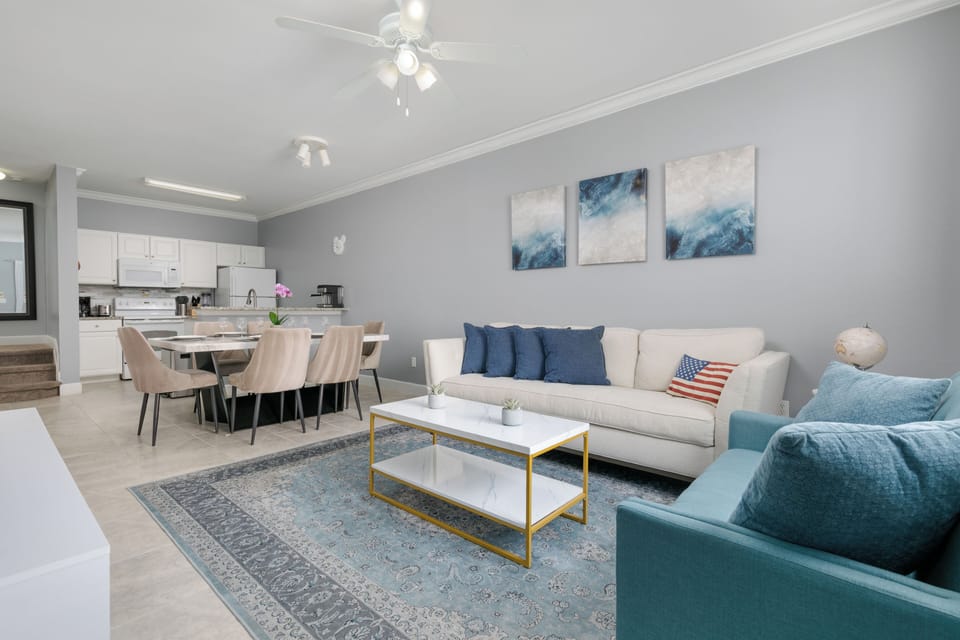 The house has an open floor plan concept, with bright and modern decor.