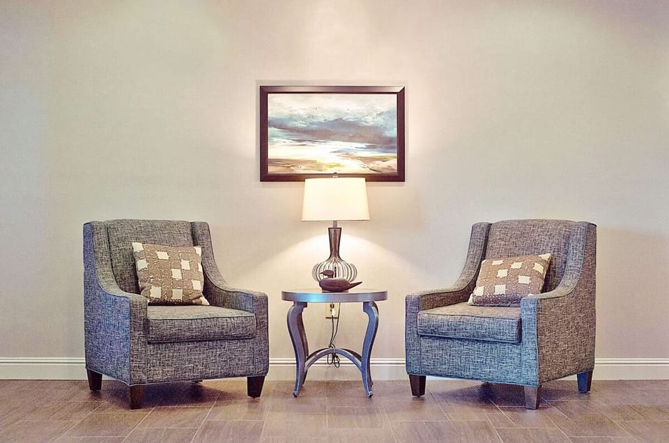 Gather by the stone fireplace for a warm evening reset.