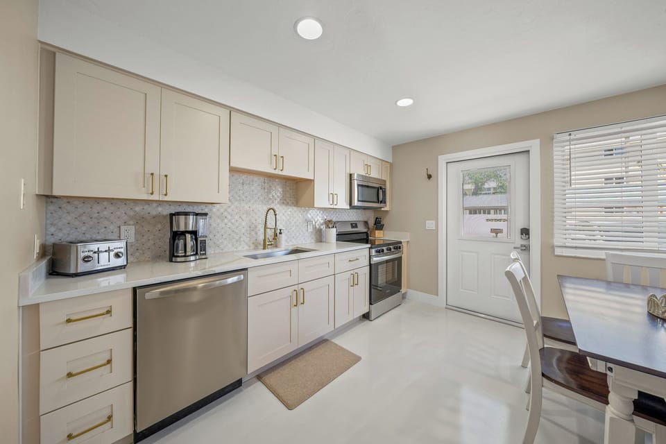 Kitchen and ample counter space and all the necessary cookware and appliances