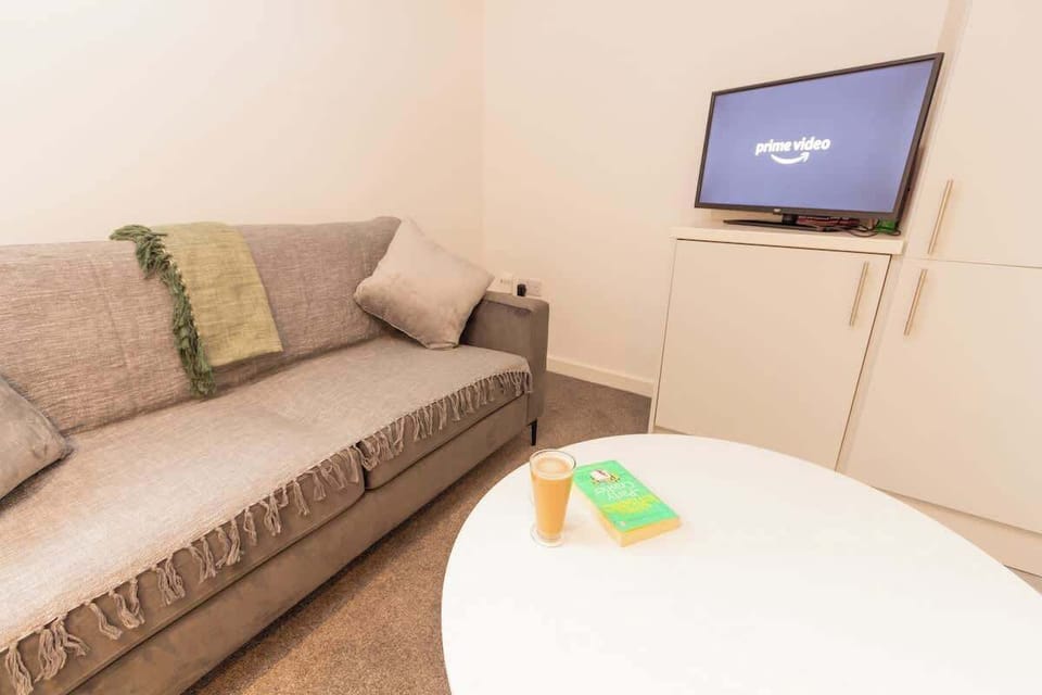 Our well-lit and spacious living room; best space for you to bond with the group.