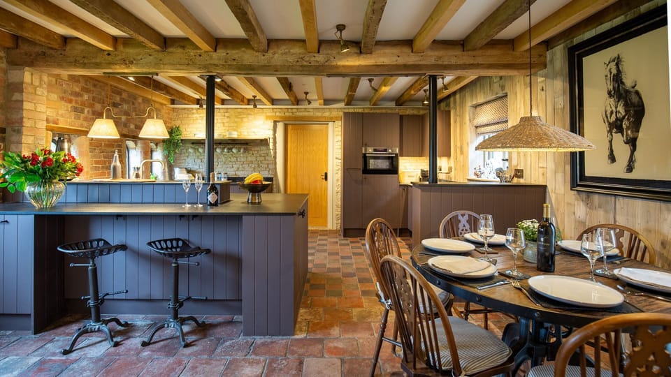 Dine in the historic Coach House beneath wooden beams
