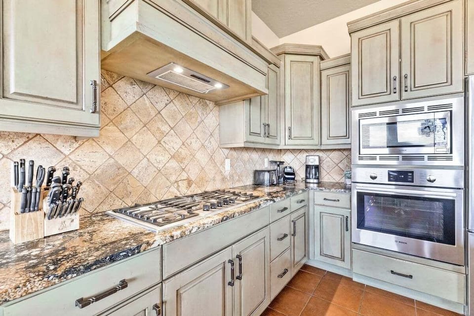 Relish in multitudes of kitchen tools, a coffee maker, and a charming dining nook to savor your culinary creations.
