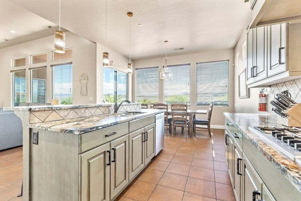 The kitchen island provides 4 barstools for additional seating and interactive cooking.