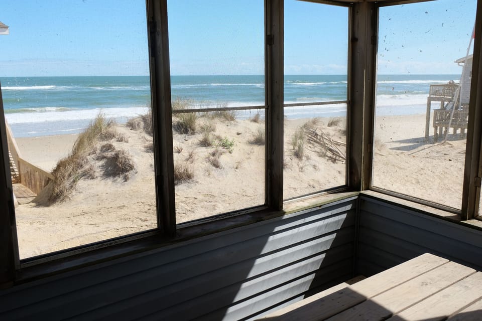 View from the screen-in porch.

Sand is common in the area, including under the house, on walkways, deck, patio, porch and street.