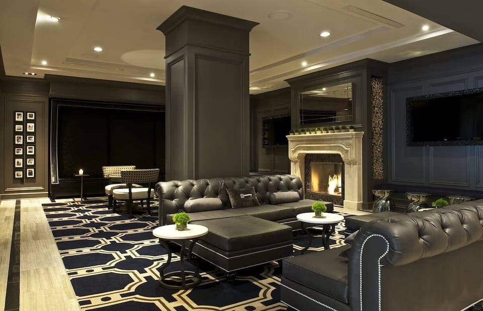 Settle into expansive, elegant seating beneath warm, ambient lighting.