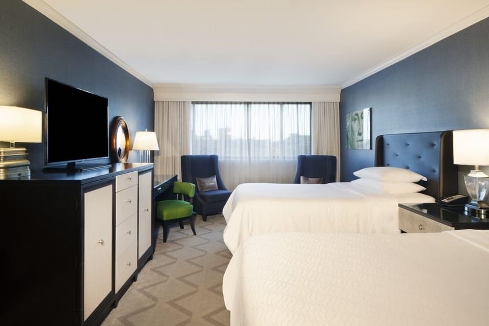 Settle in comfortably with two plush beds and calm lighting.