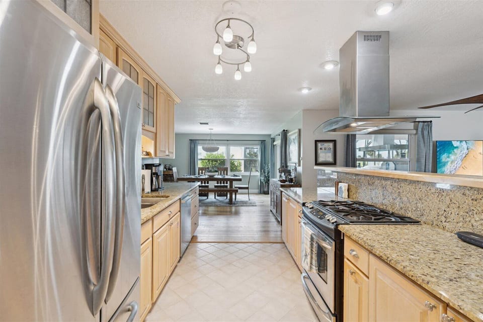 Cook with ease in a modern kitchen featuring stainless steel appliances and lots of prep space.