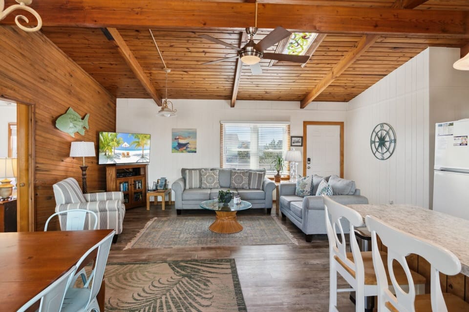Relax in the spacious Living Area with a Flat Screen TV and high ceilings!
