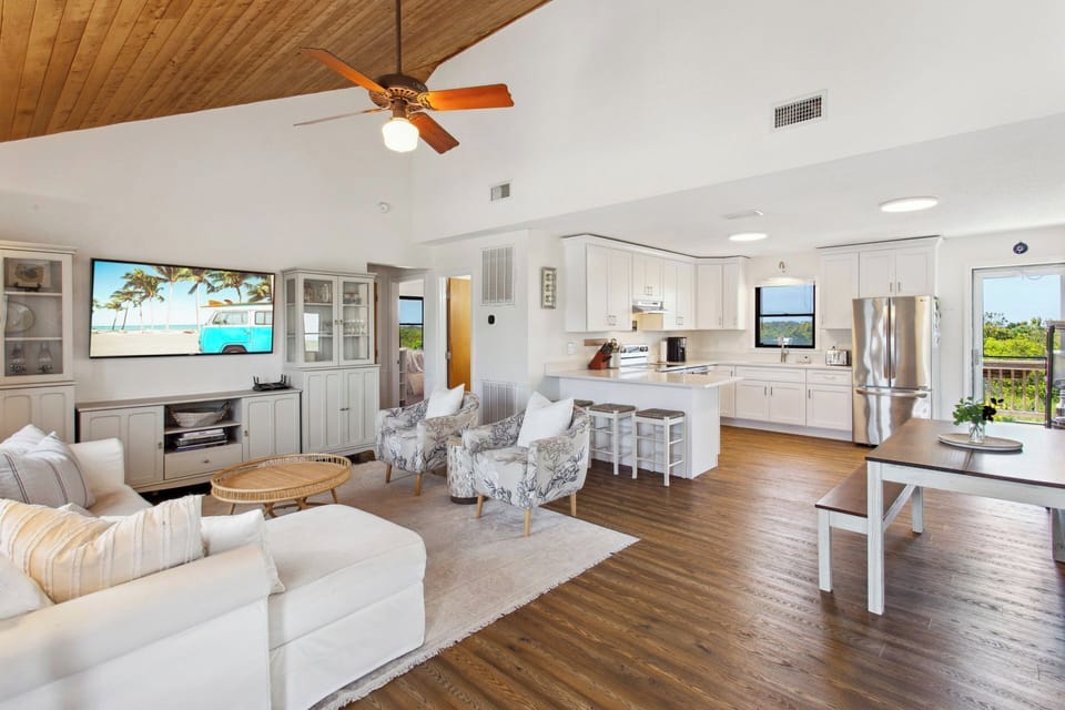 Relax in the beautiful Living Area with a Flat Screen TV and high ceilings!