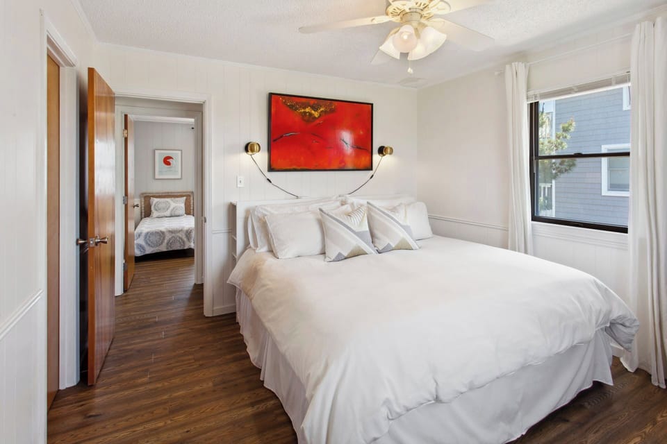 Enjoy a little extra luxury in the serene King Bedroom with a Flat Screen TV and semi-private access to a Full Hallway Bathroom!