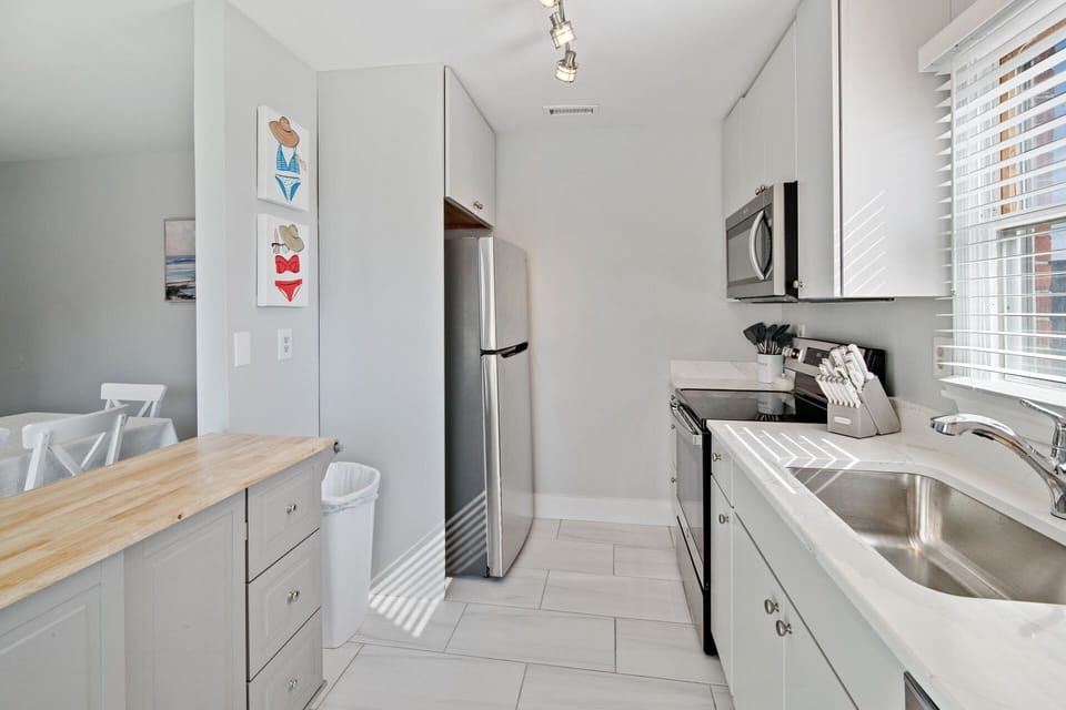 The modern kitchen is complete with stainless steel appliances.