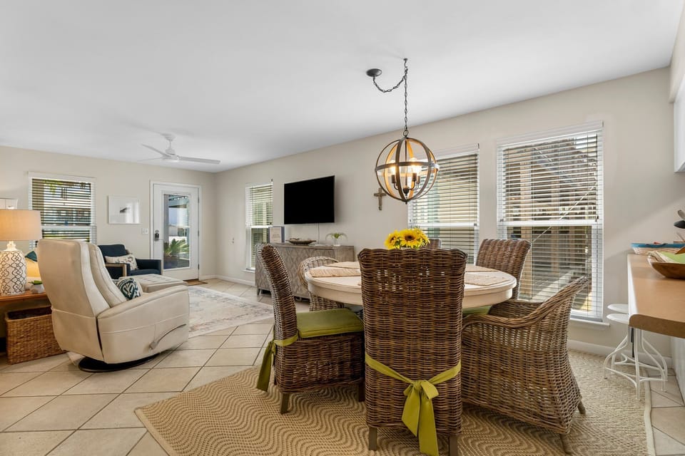 The dining room area, conveniently adjacent to the living room, facilitates seamless flow between dining and relaxation spaces.