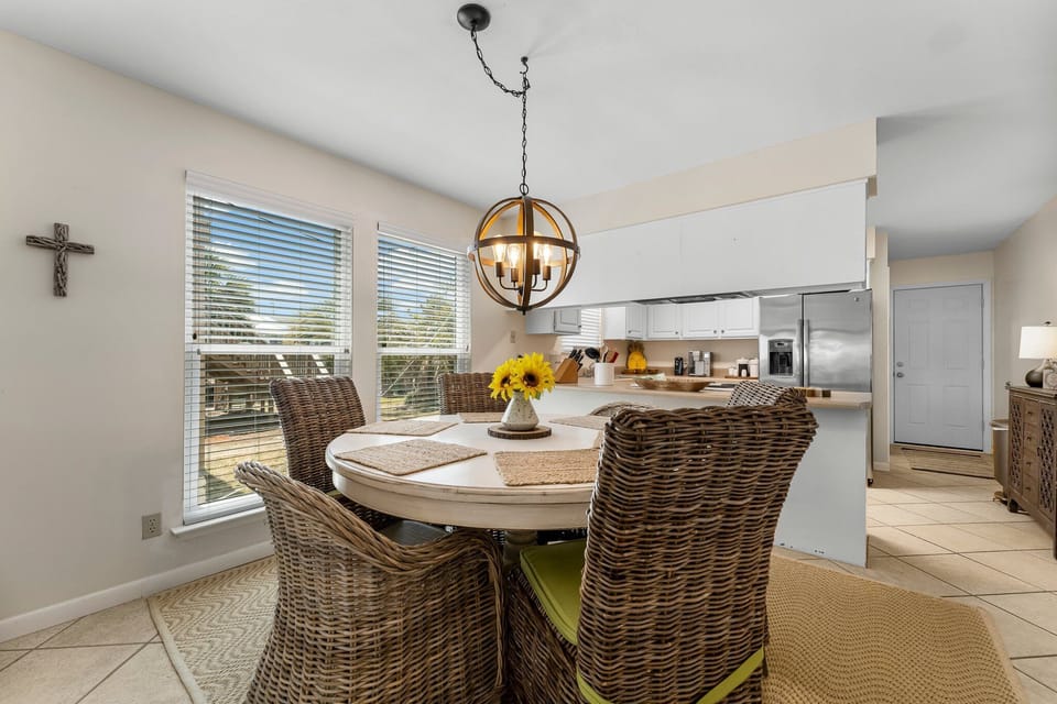 The dining area comfortably seats four people, creating an intimate setting for shared meals and conversation.