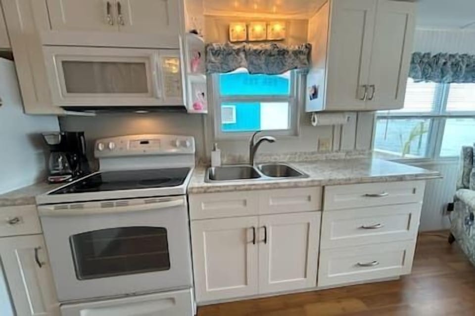 Full Kitchen with Refrigerator + Range/Oven + Sink + Microwave