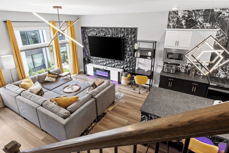 Cozy up in the stylish living room with a view of the walkway to the on-site dog park. Great for people watching, movie night, or curling up with a good book.