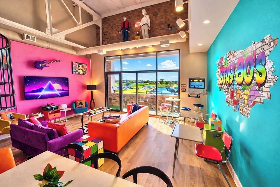Step into pure 80s nostalgia—bold colors, neon vibes, and marina views glowing through sunlit windows. Kick back on the vibrant sofa, relive retro game nights, and wake up to blue skies over the docks. Playful, bright, unforgettable!