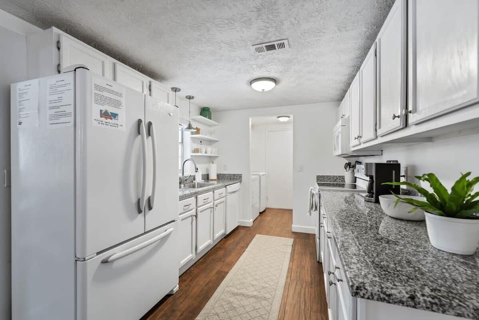 Behind the kitchen has Free Washer and Dryer and Pool Bar Window