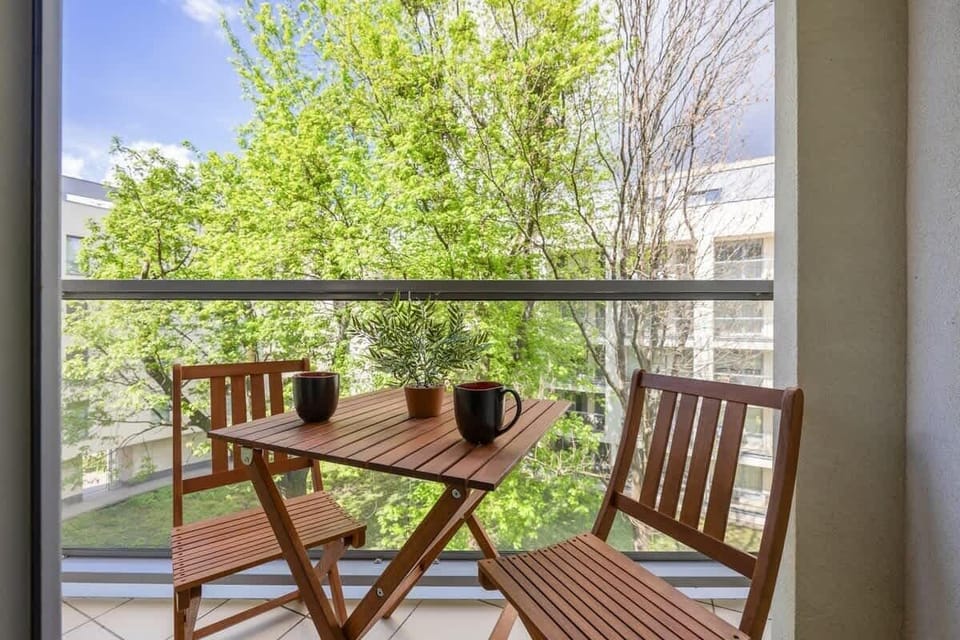 The balcony provides a perfect spot for enjoying the fresh air. 
