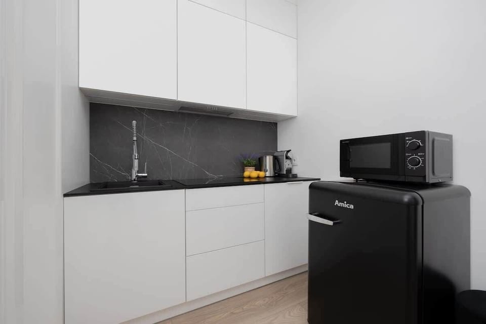 The fully equipped kitchenette includes everything you need for a home-cooked meal.