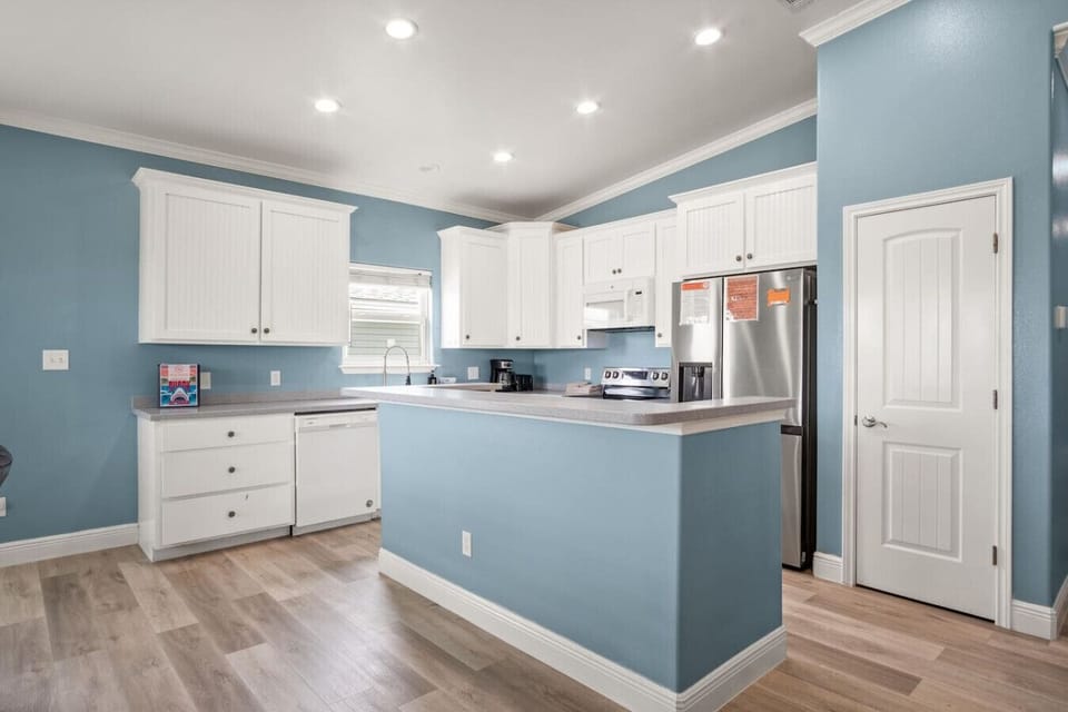 Fully equipped kitchen with modern appliances and plenty of counter space.