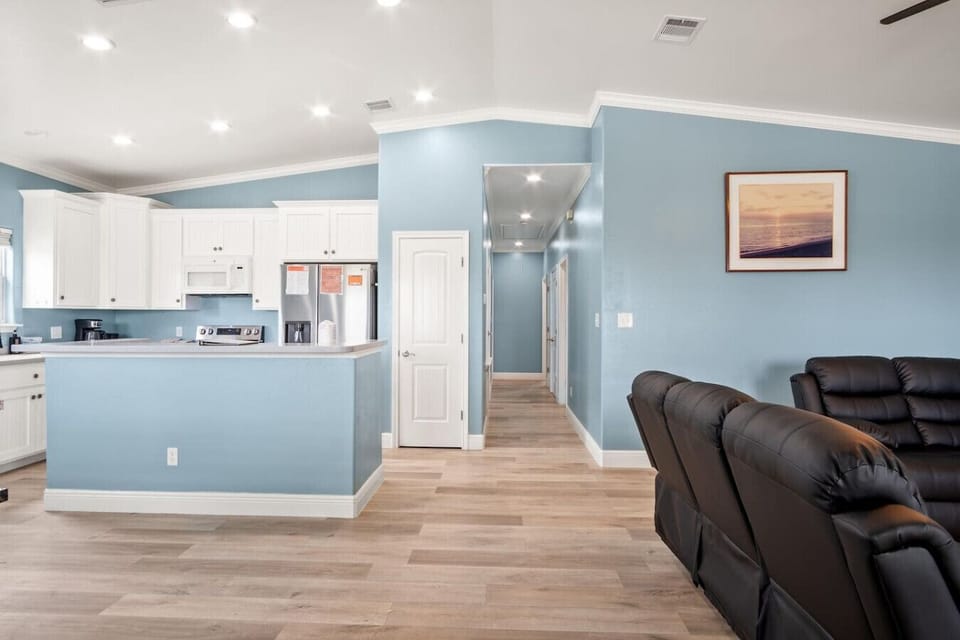 Open-concept layout connecting the living room and kitchen.