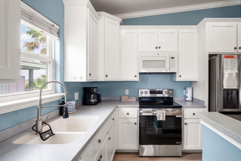 Modern kitchen with stainless steel appliances and plenty of prep space.
