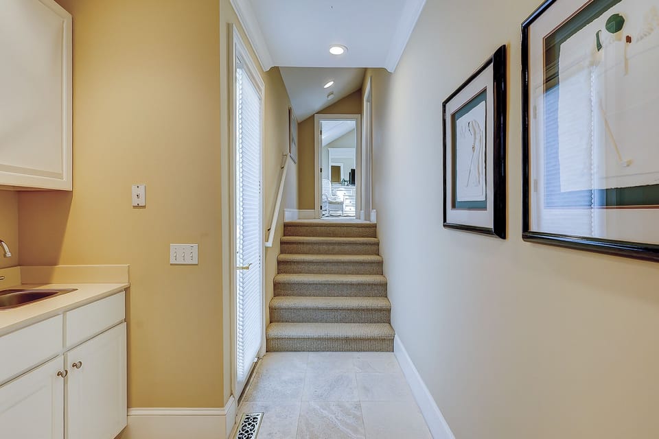 Stairway to double and twin bedroom