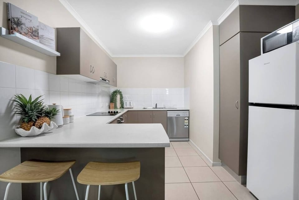 Whip up delicious meals in the well-equipped kitchen, complete with ample bench space and modern appliances. 