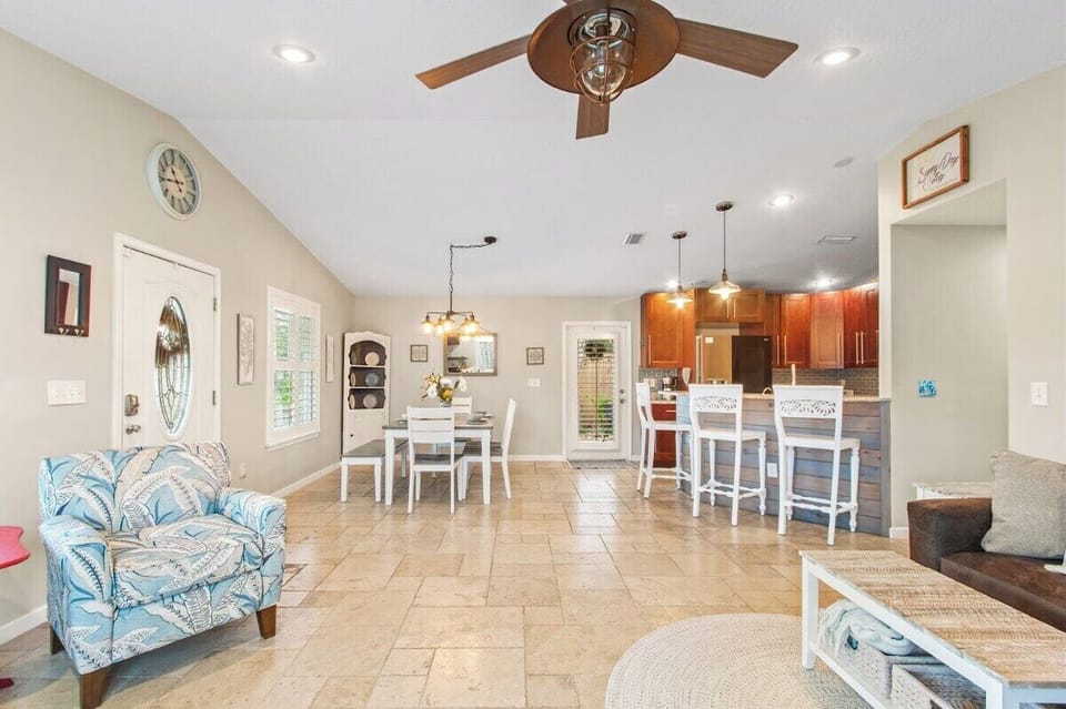 View of the dining room and kitchen. Access the side yard and back yard from the kitchen and the master bedroom.