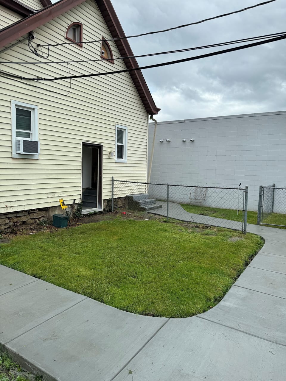 Back yard view from private parking area