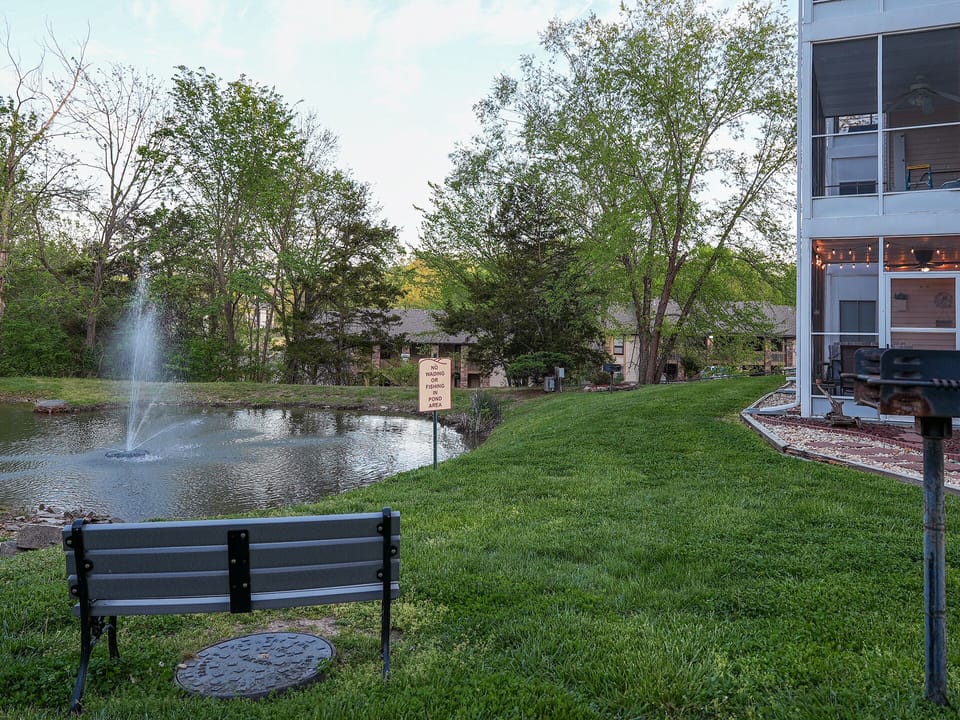Pond directly outside condo. Charcoal grills also available.