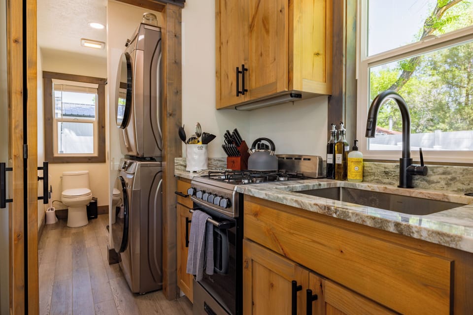 Stacked washer and dryer is available in the bathroom for guest use
