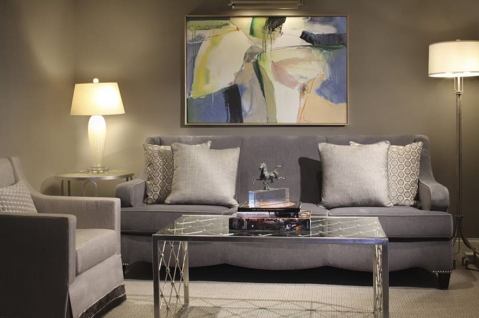 Sink into the sofa with warm lamps and relaxing artwork.