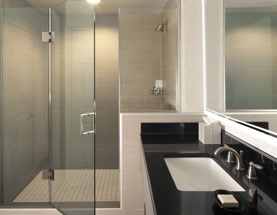 Rinse off in the glass-walled shower with spa-like calm.