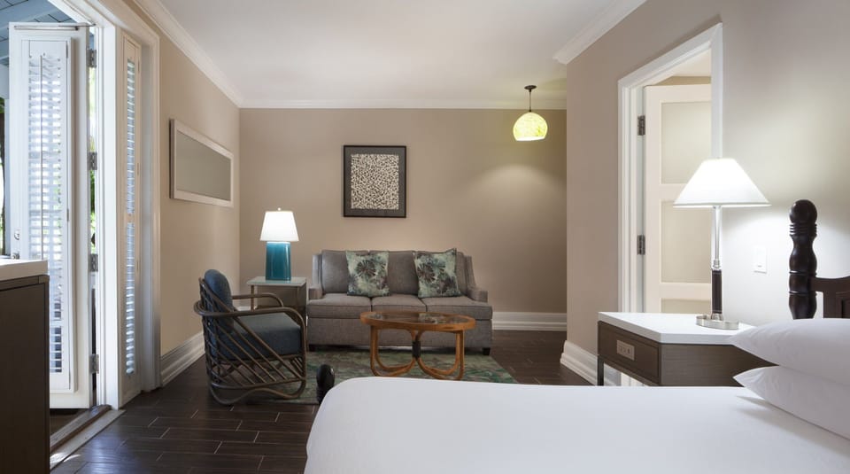 Linger over morning coffee with cozy seating beside the bed.