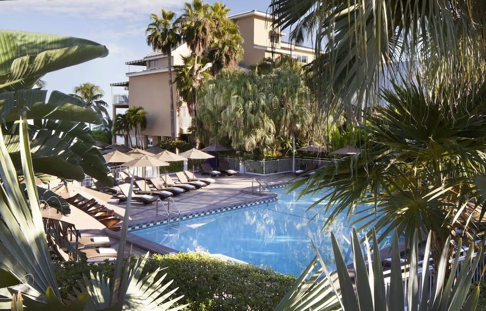 Stretch out poolside and enjoy calm, tropical surroundings.