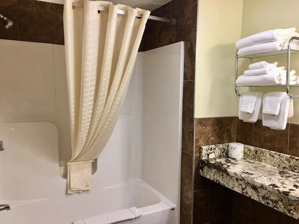 Rinse off and recharge in a clean tub-shower retreat.