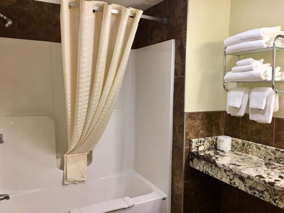Rinse off and recharge in a clean tub-shower retreat.