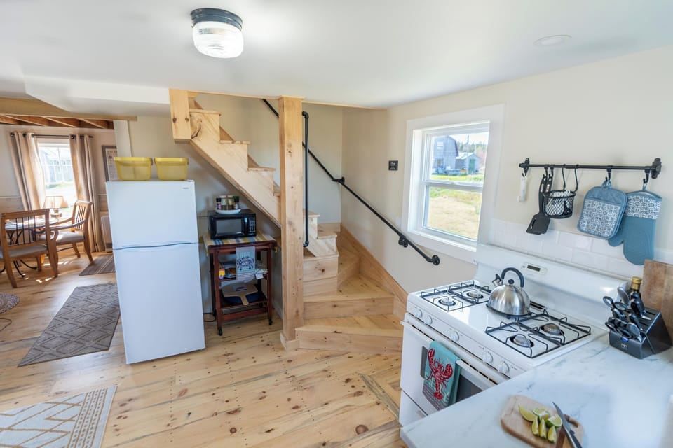 Rustic stairwell from the kitchen leading up to the second floor bed rooms. 