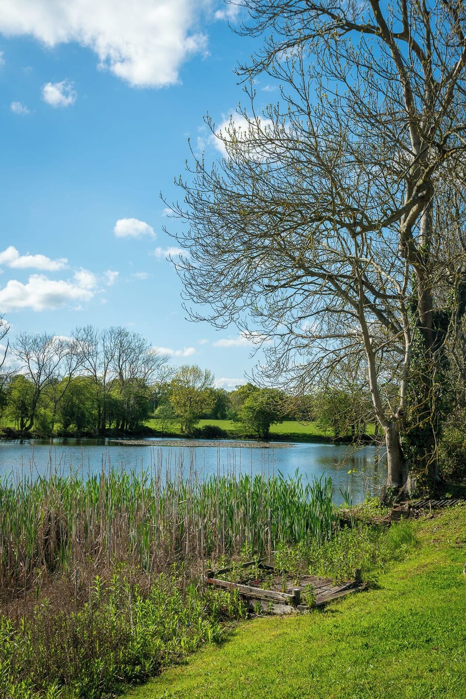 The tranquil private lake is a few metres from the cottage