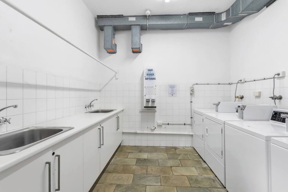 The complex features a convenient shared laundry facility, ensuring that all guests have easy access to essential laundry services whenever they need them.
