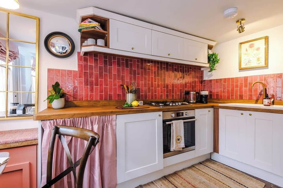 Washing machine behind the curtain. 