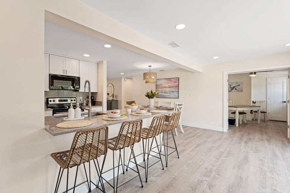 Four bar stools at the breakfast bar are perfect to grab a quick snack or cup of coffee.  Off the Florida room is an office with desk, chair and direct ethernet cable.