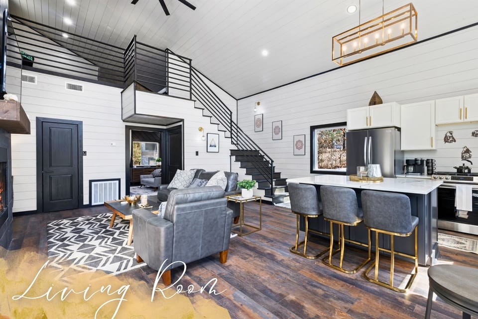 Our living room, featuring a cozy loft and elegant interiors, is the ideal place to unwind and gather.
