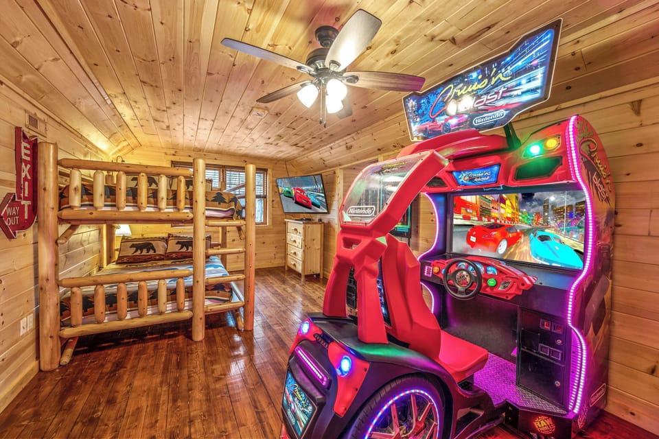 Bedroom / Gameroom with queen over queen custom log frame bunkbed, full size racing arcade
