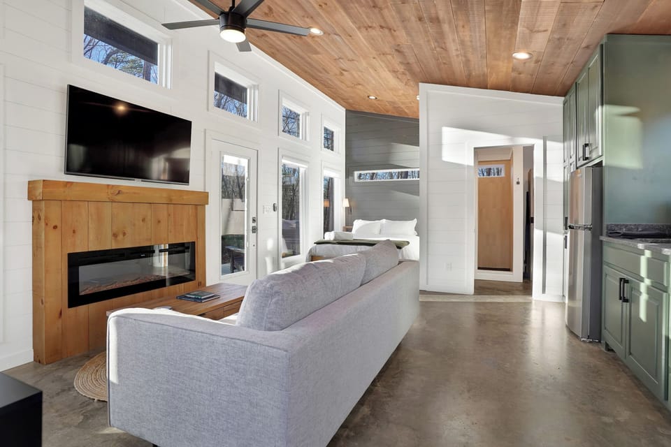 Full concrete floors and tall ceilings throughout.