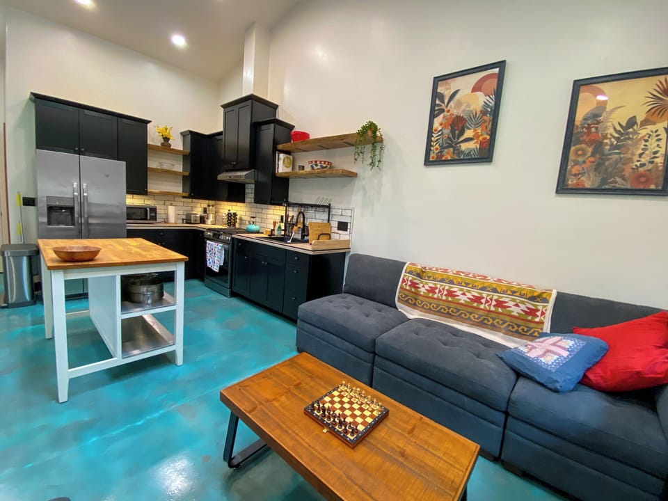 The radiant heated, stained and waxed cement floor feels amazing!  