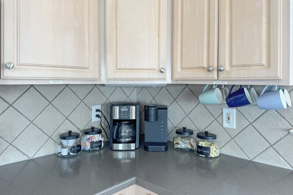 We provide a coffee bar with creamer, Splenda, sugar, grounds, and K-cups.