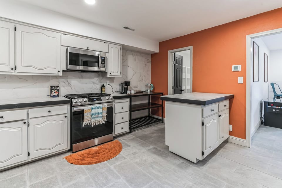 Spacious and fully equipped kitchen with ample cupboards 