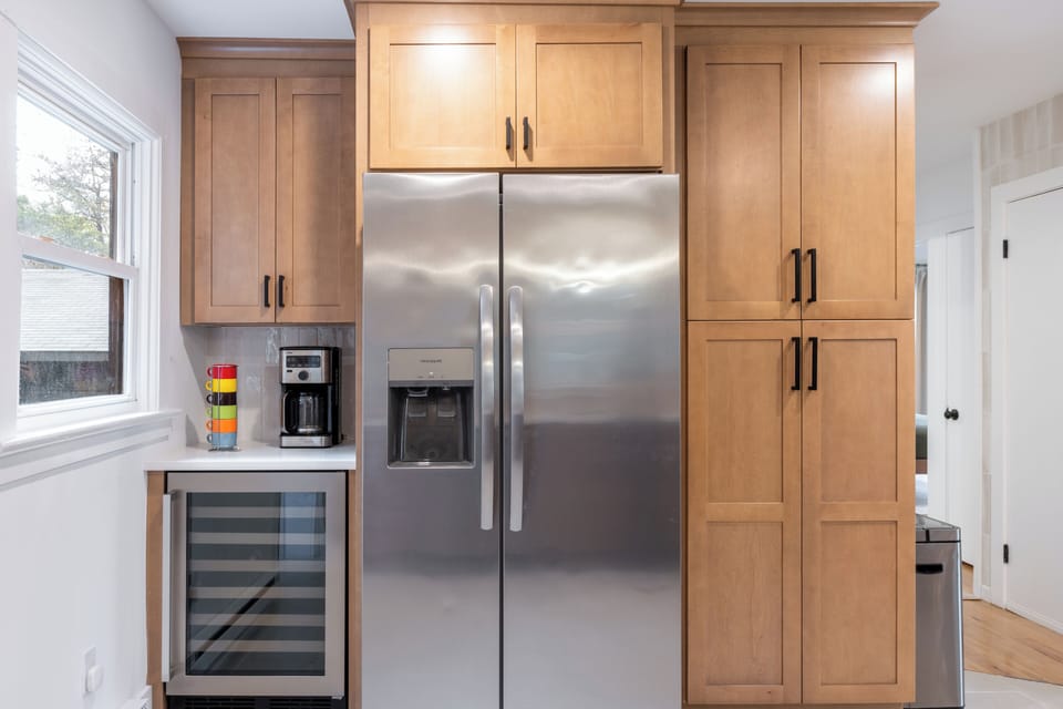 Large fridge, coffee machine, and plenty of storage.